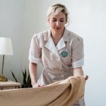 photo of a person making bed
